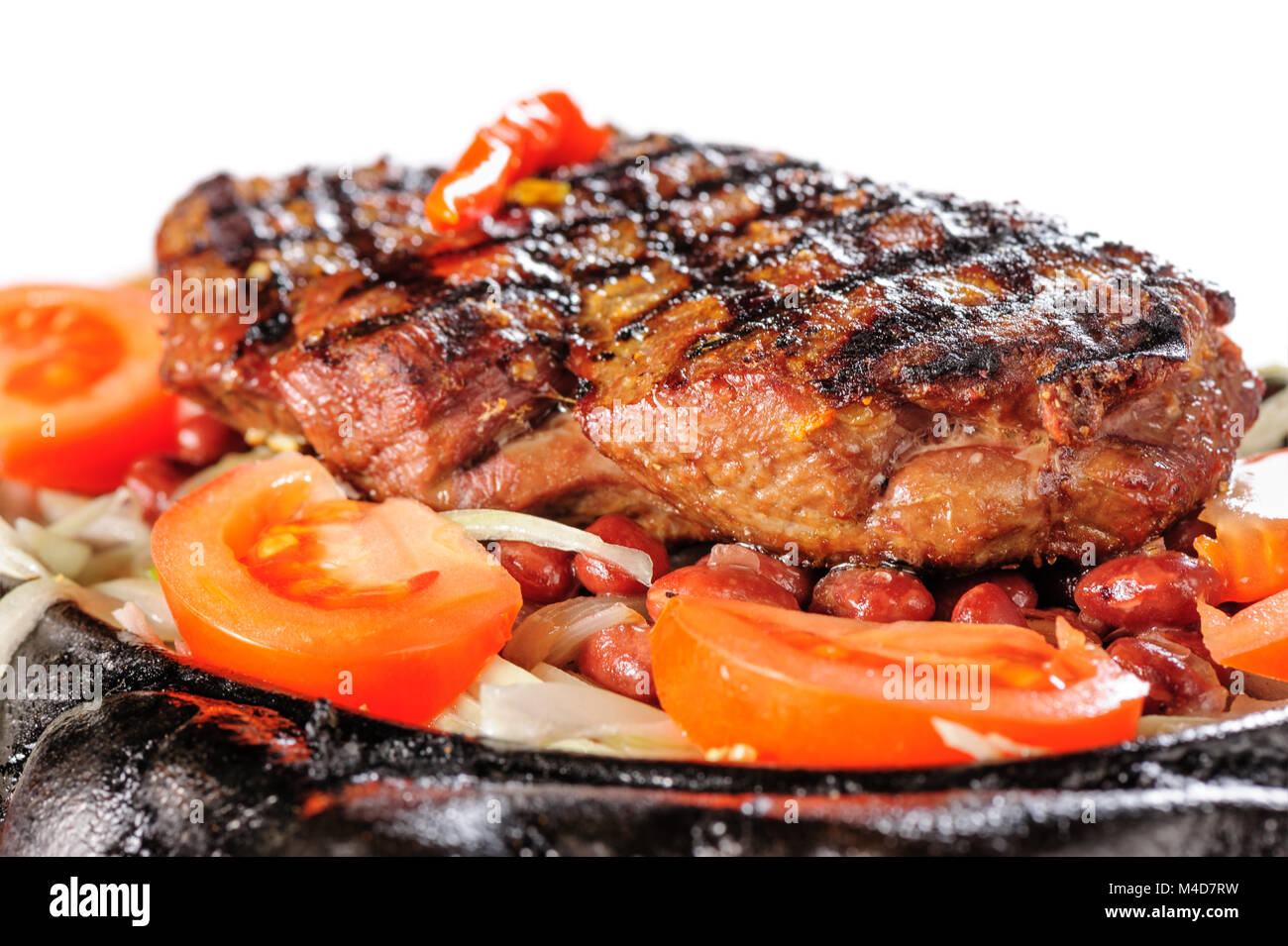 Beef steak with red beans garnish Stock Photo