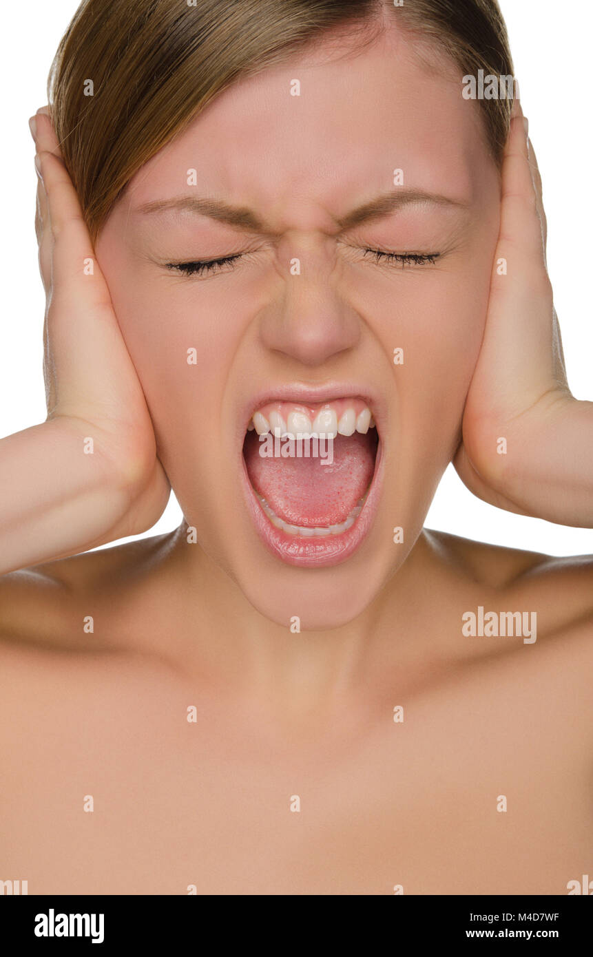 Beautiful emotional woman covers her ears with her hands Stock Photo