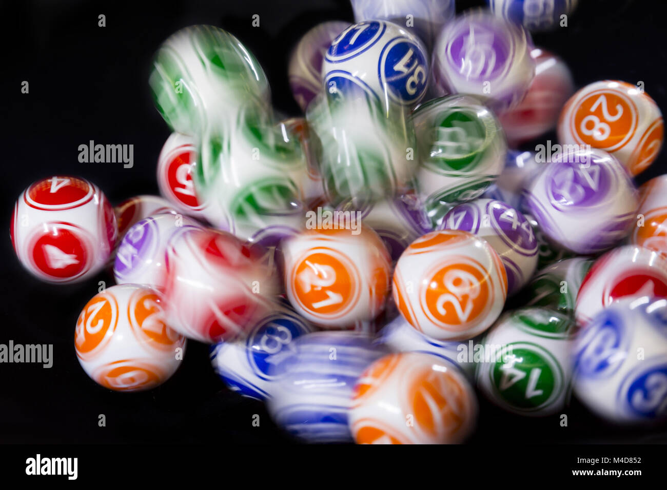 Colourful lottery balls in a machine Stock Photo Alamy