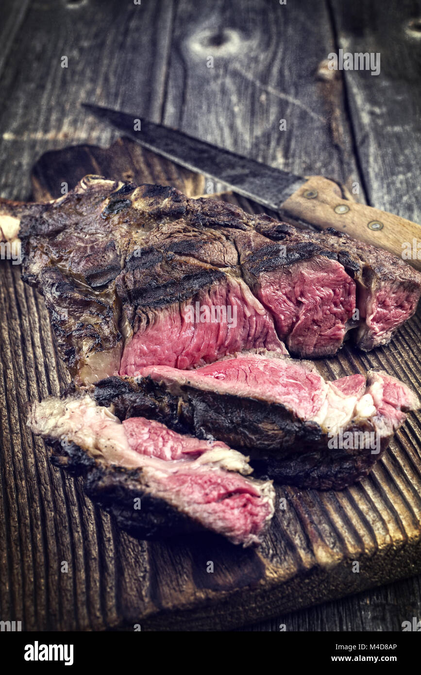 Barbecue Tomahawk Steak on Cutting Board Stock Photo