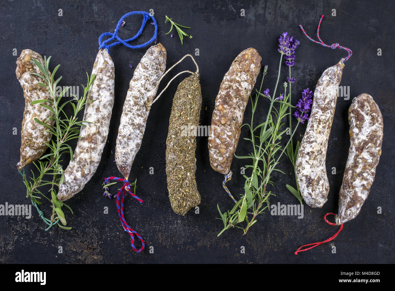Salami with herb on old Metall Sheet Stock Photo