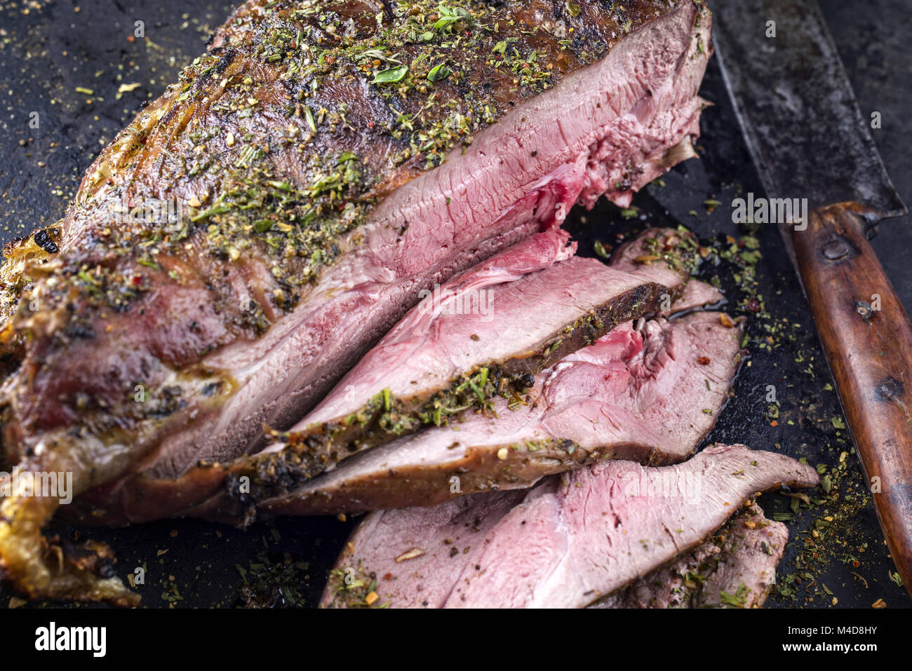 Barbecue Haunch of Venison on old Metal Sheet Stock Photo