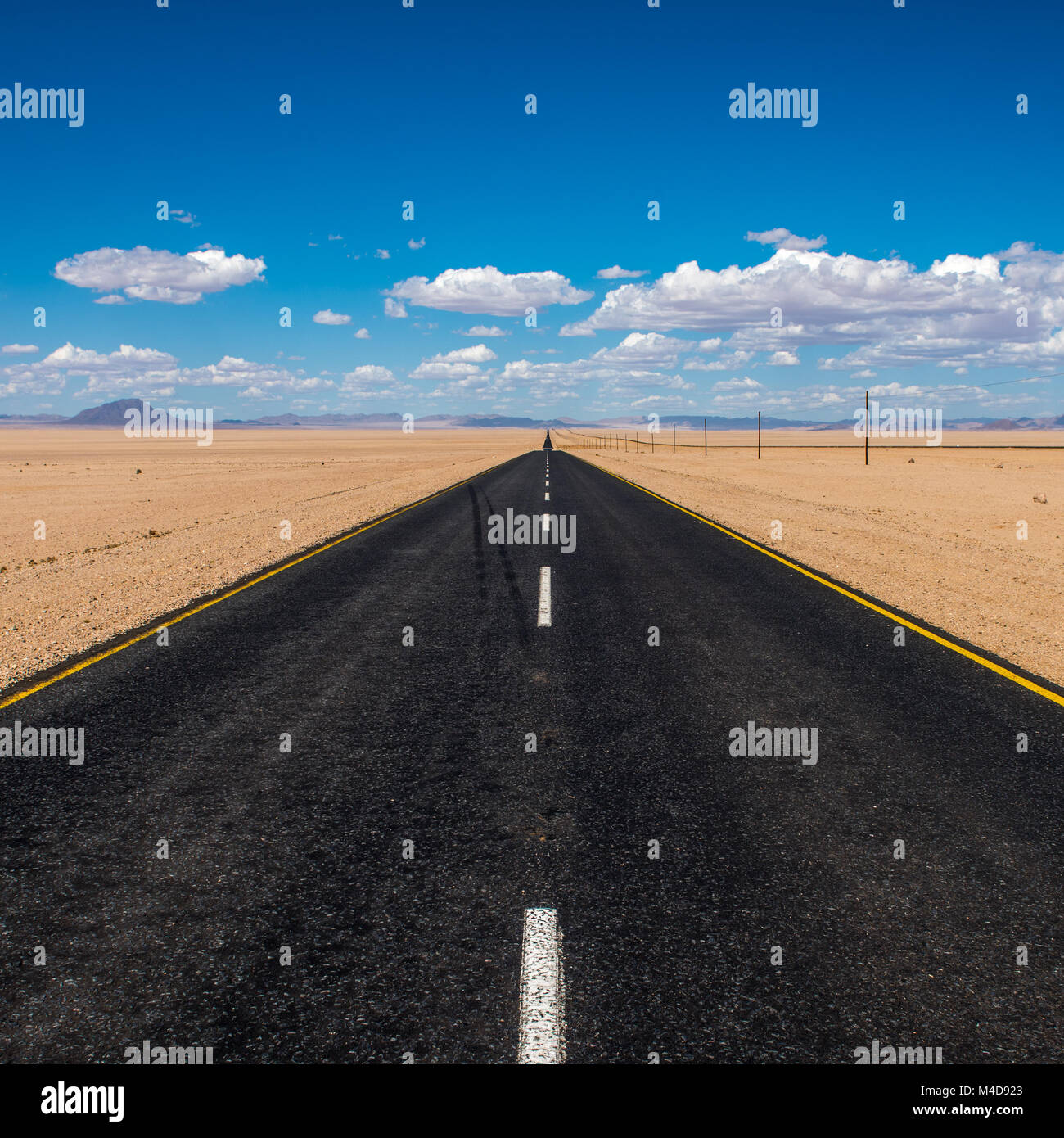 vibrant image of highway and blue cloudy sky Stock Photo - Alamy