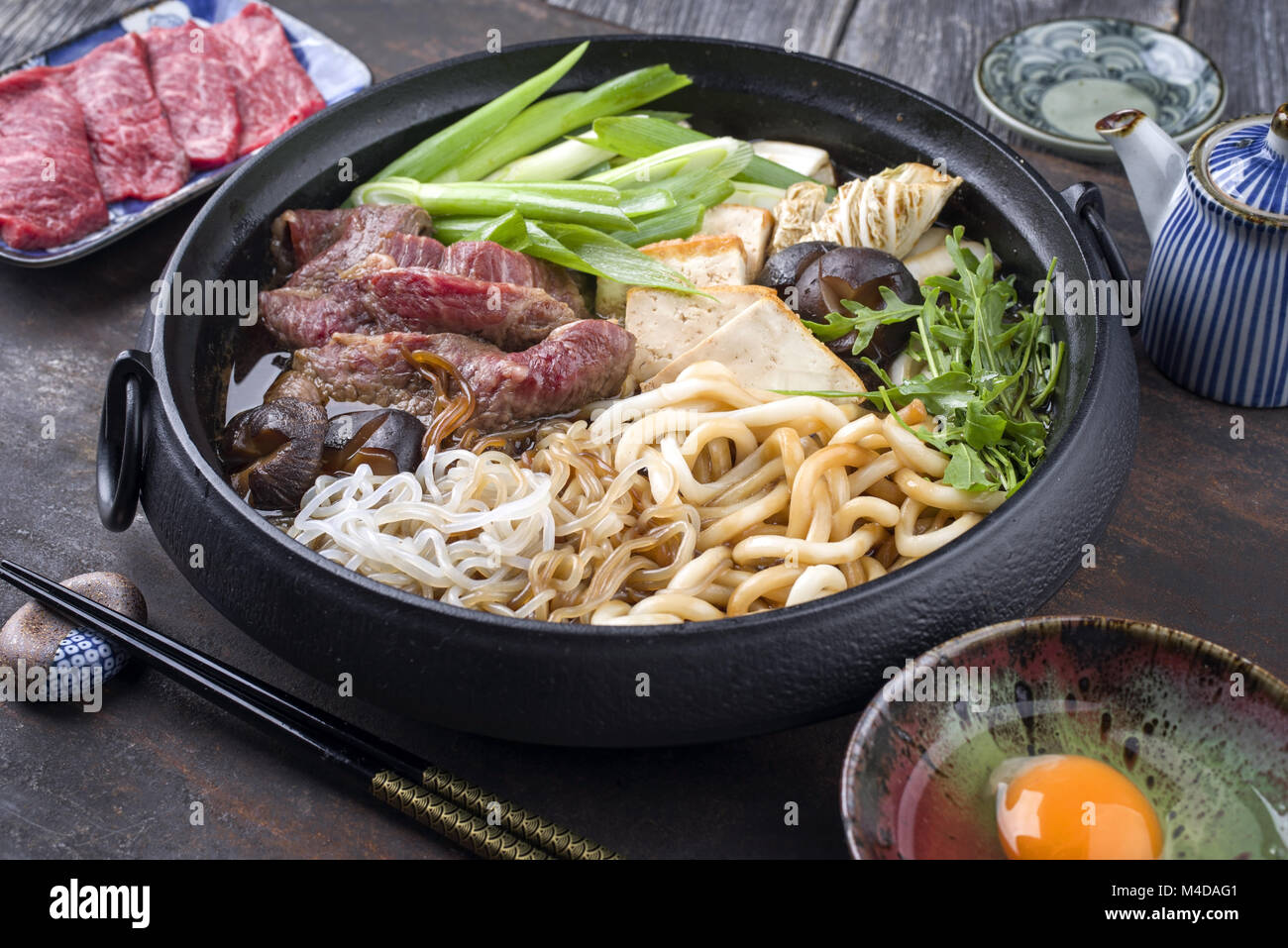 https://c8.alamy.com/comp/M4DAG1/japanese-sukiyaki-in-traditional-cast-iron-pot-M4DAG1.jpg