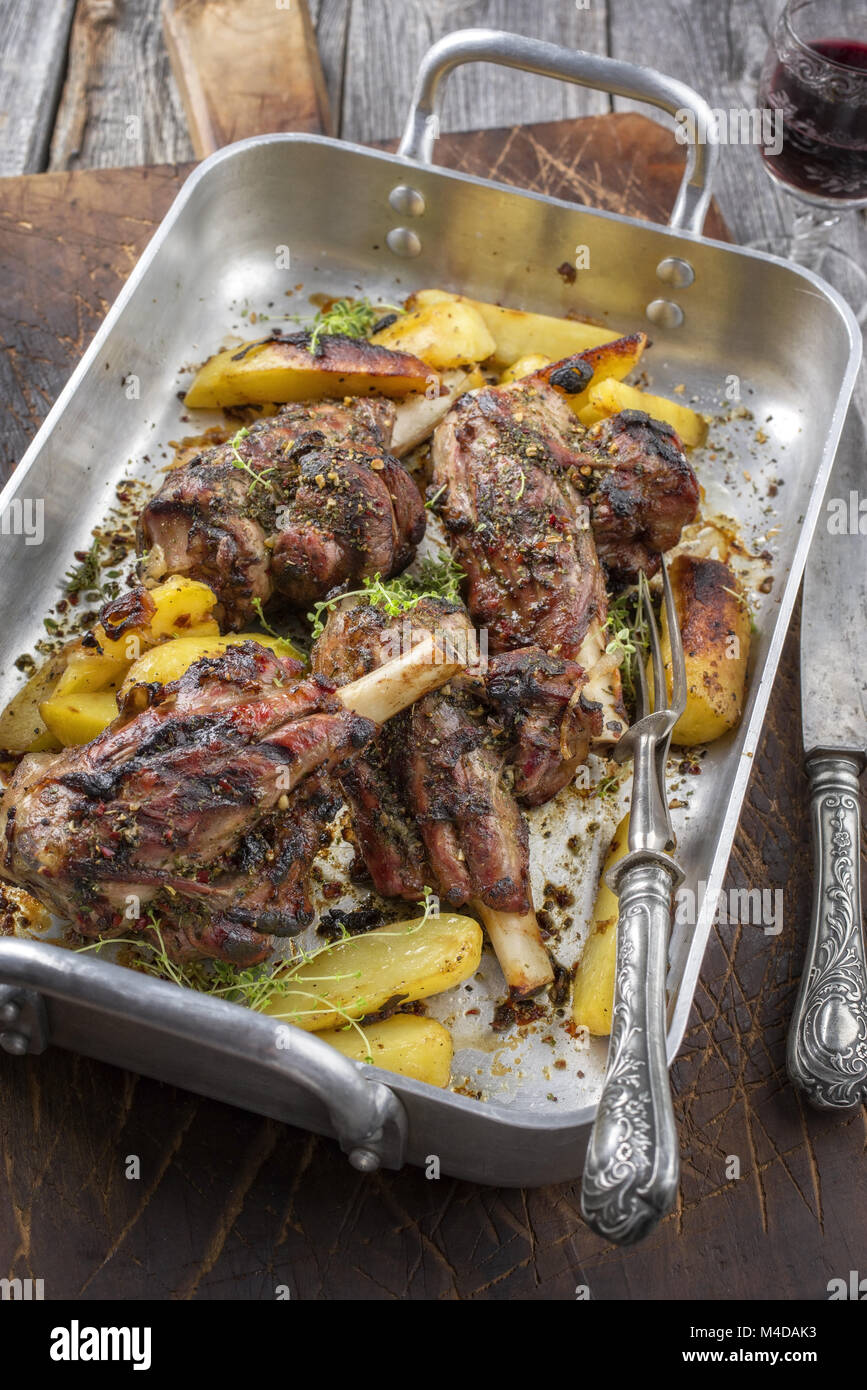 Lamb Knuckle with Fried Potatoes in Roasting Dish Stock Photo Alamy