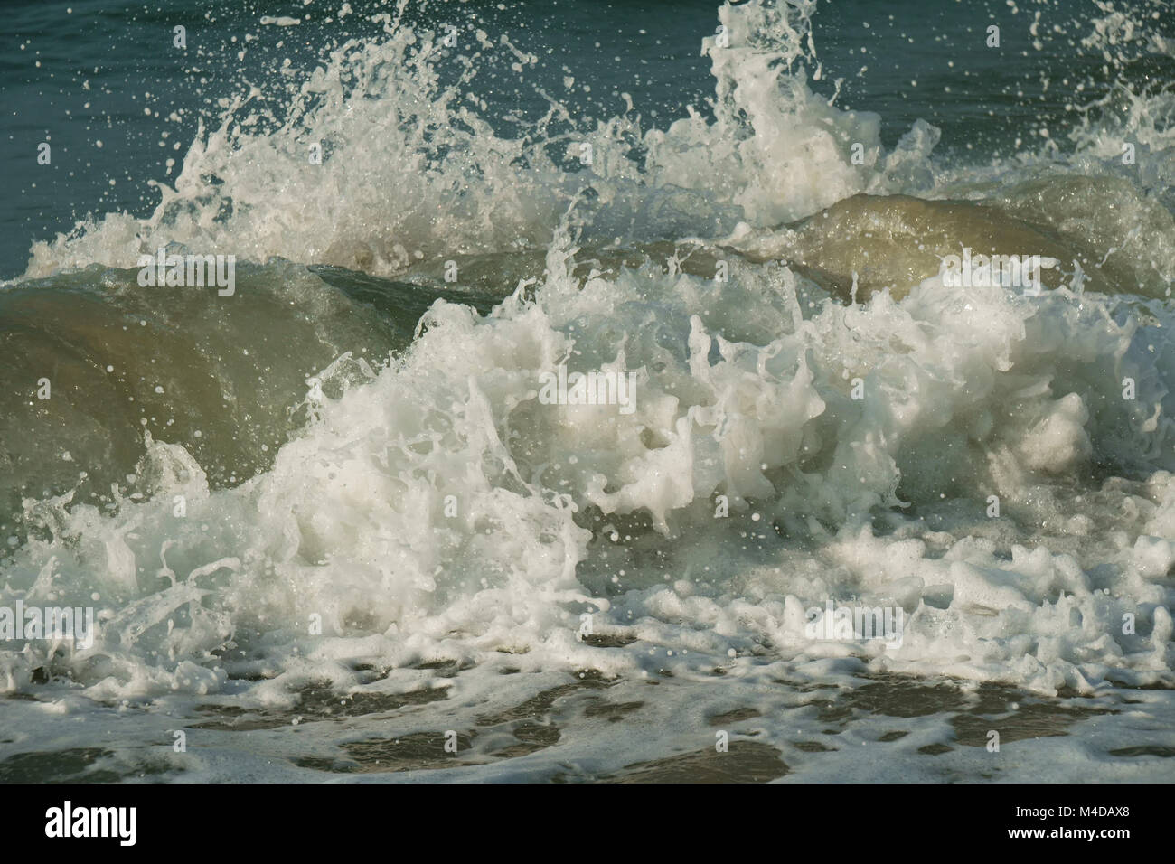 Beautiful waves of South China Sea on Dadonghai beach. Stock Photo