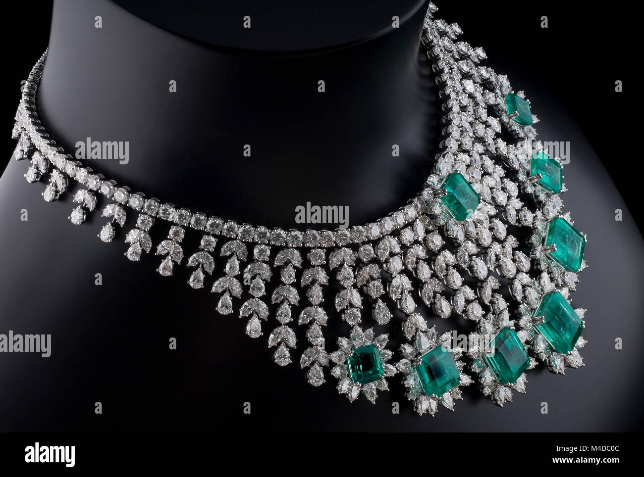 white gold necklace with green emeralds 
