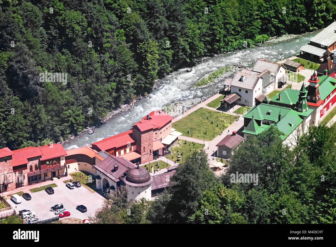 Hotel complex in the mountains near the river. Stock Photo