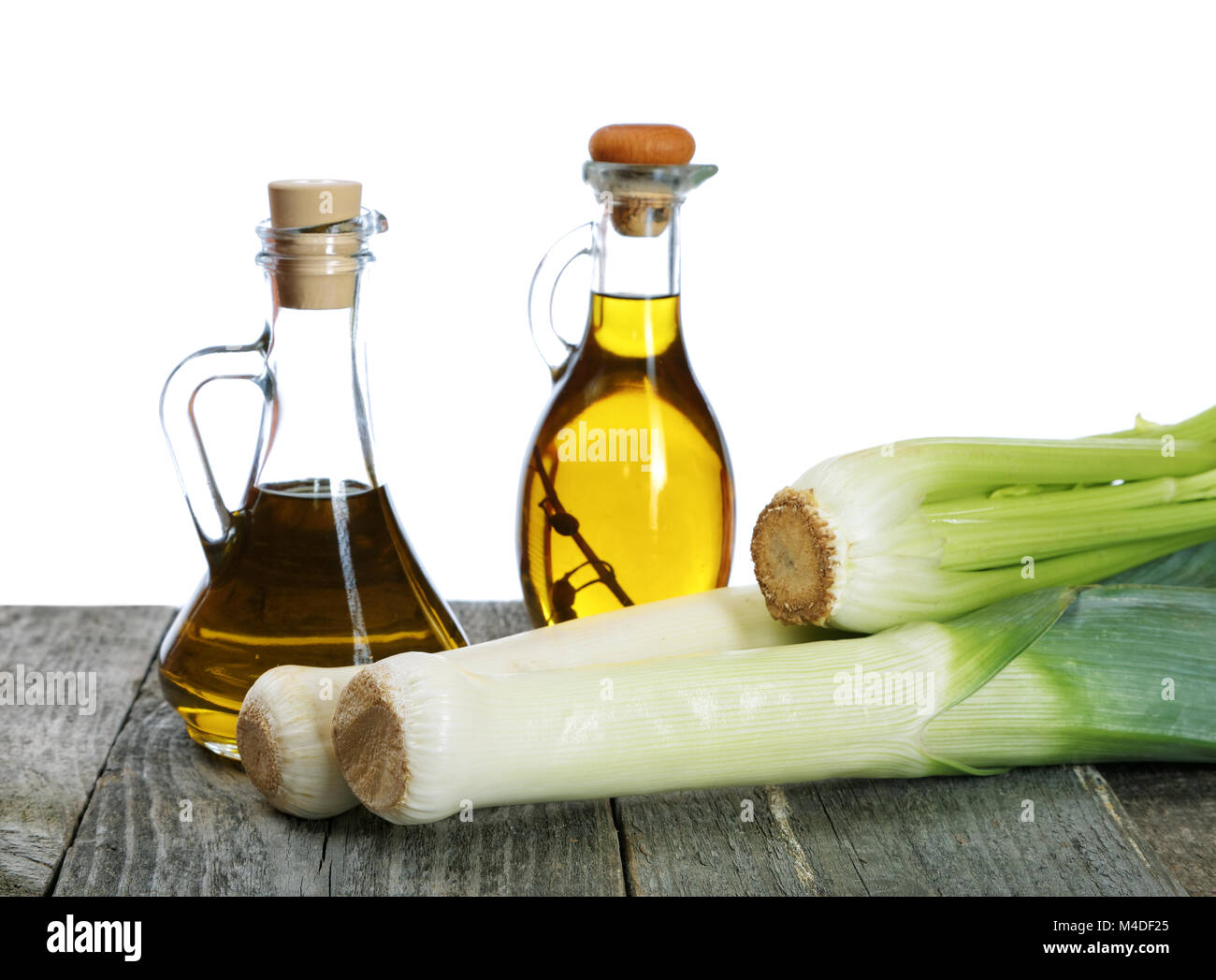shallots and bottles of olive oil on rustic table Stock Photo Alamy