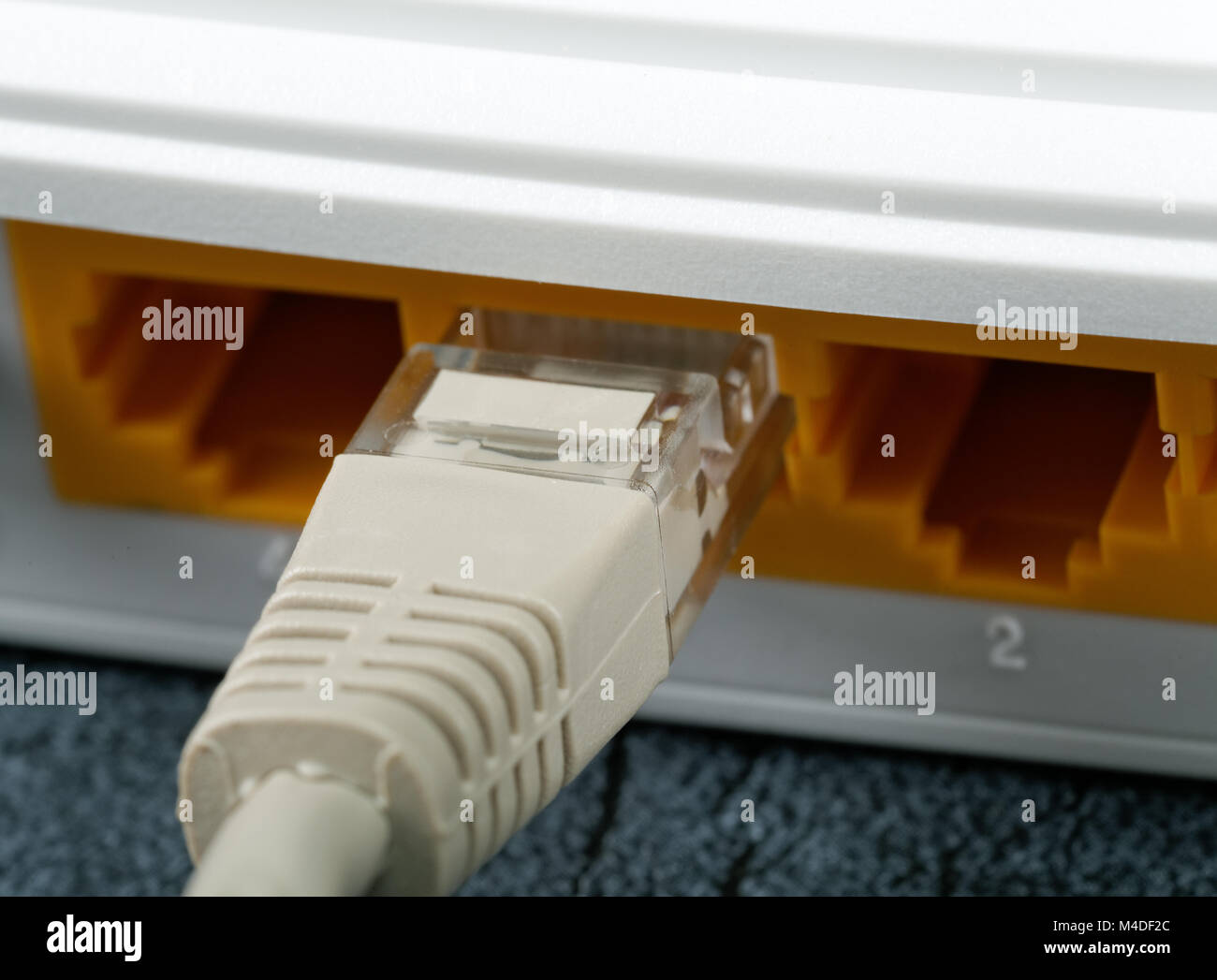 Wireless Routers and Networking Cable on table Stock Photo Alamy