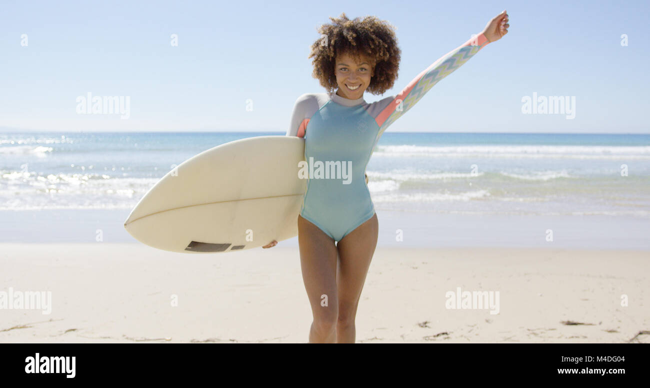 Female holding surfboard on sea background Stock Photo