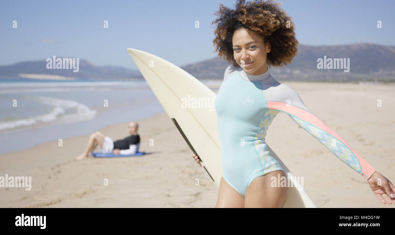 Female posing with surfboard Stock Photo
