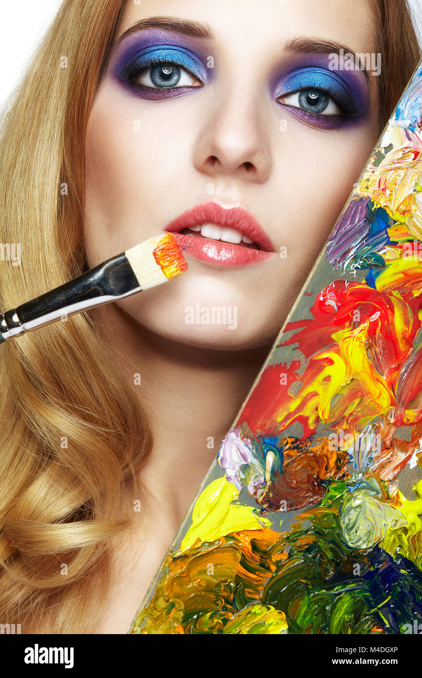 Young woman painter with color palette and paint brush Stock Photo - Alamy