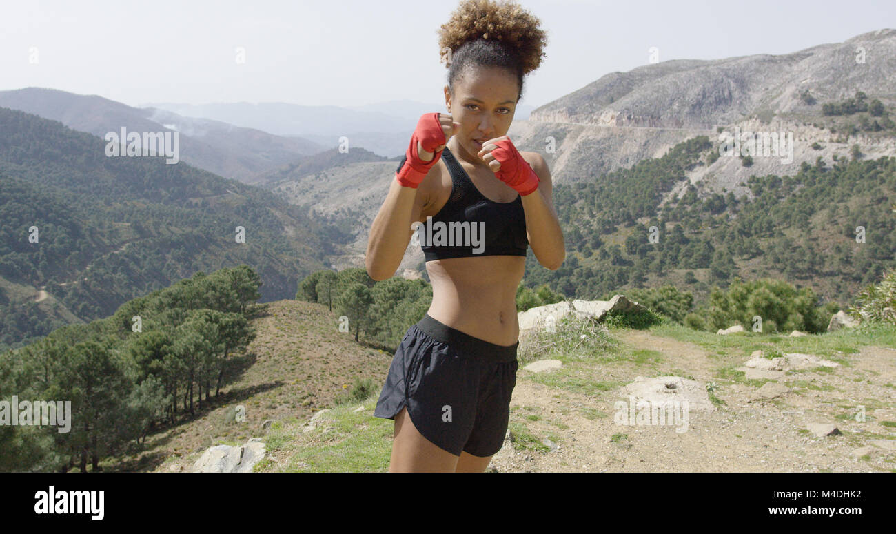 Young girl posing as boxer Stock Photo