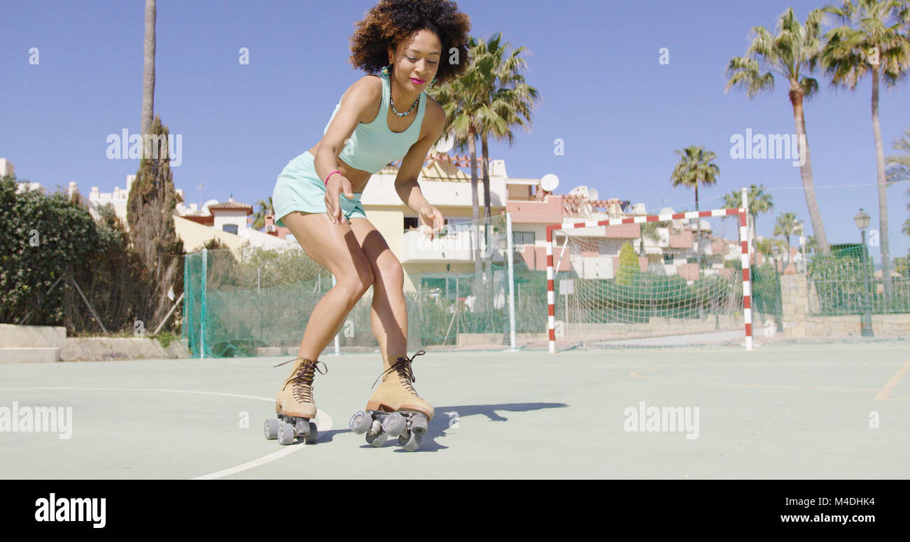 Roller Skates Riding Young pretty woman riding in roller skates Stock Photo - Alamy