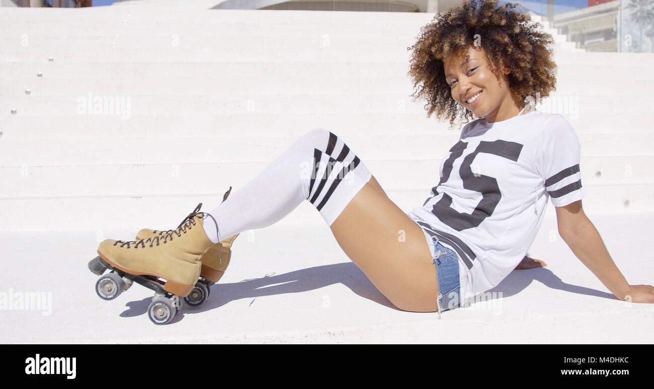 Female wearing roller skates posing Stock Photo Alamy