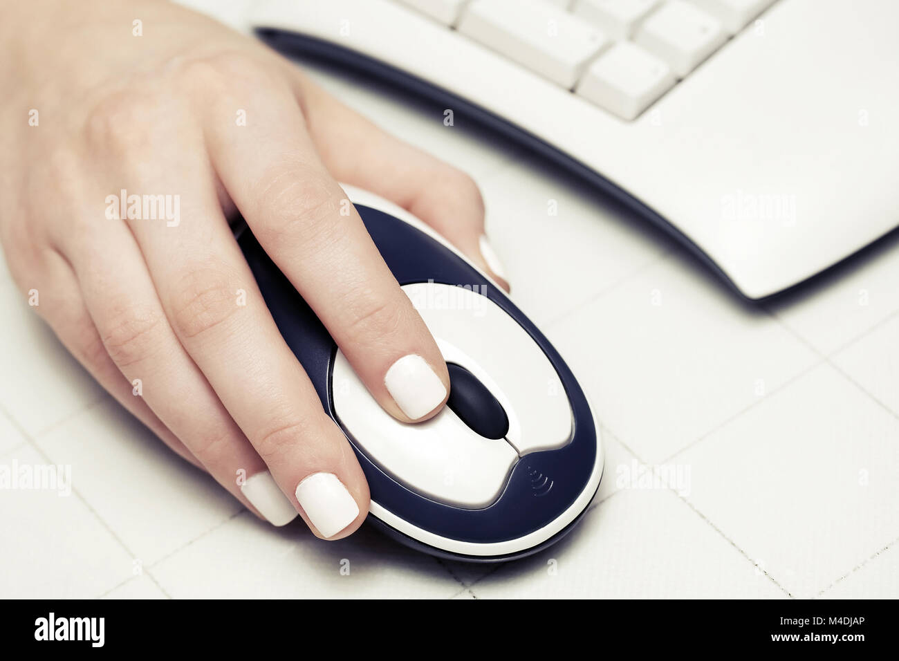 Female hand using computer mouse Stock Photo - Alamy