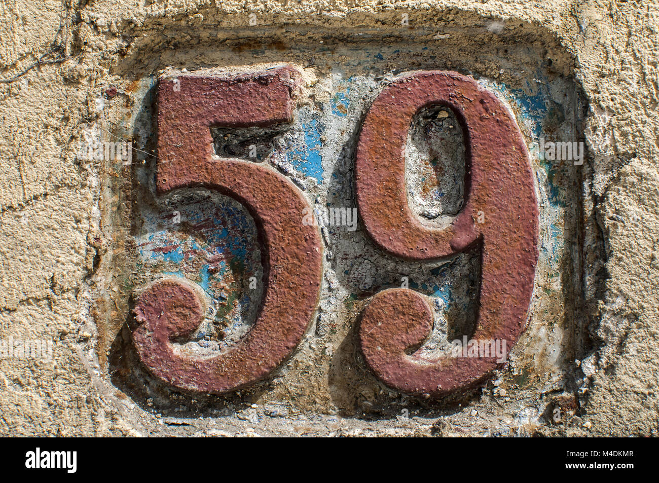Old retro cast iron plate number 59 Stock Photo Alamy