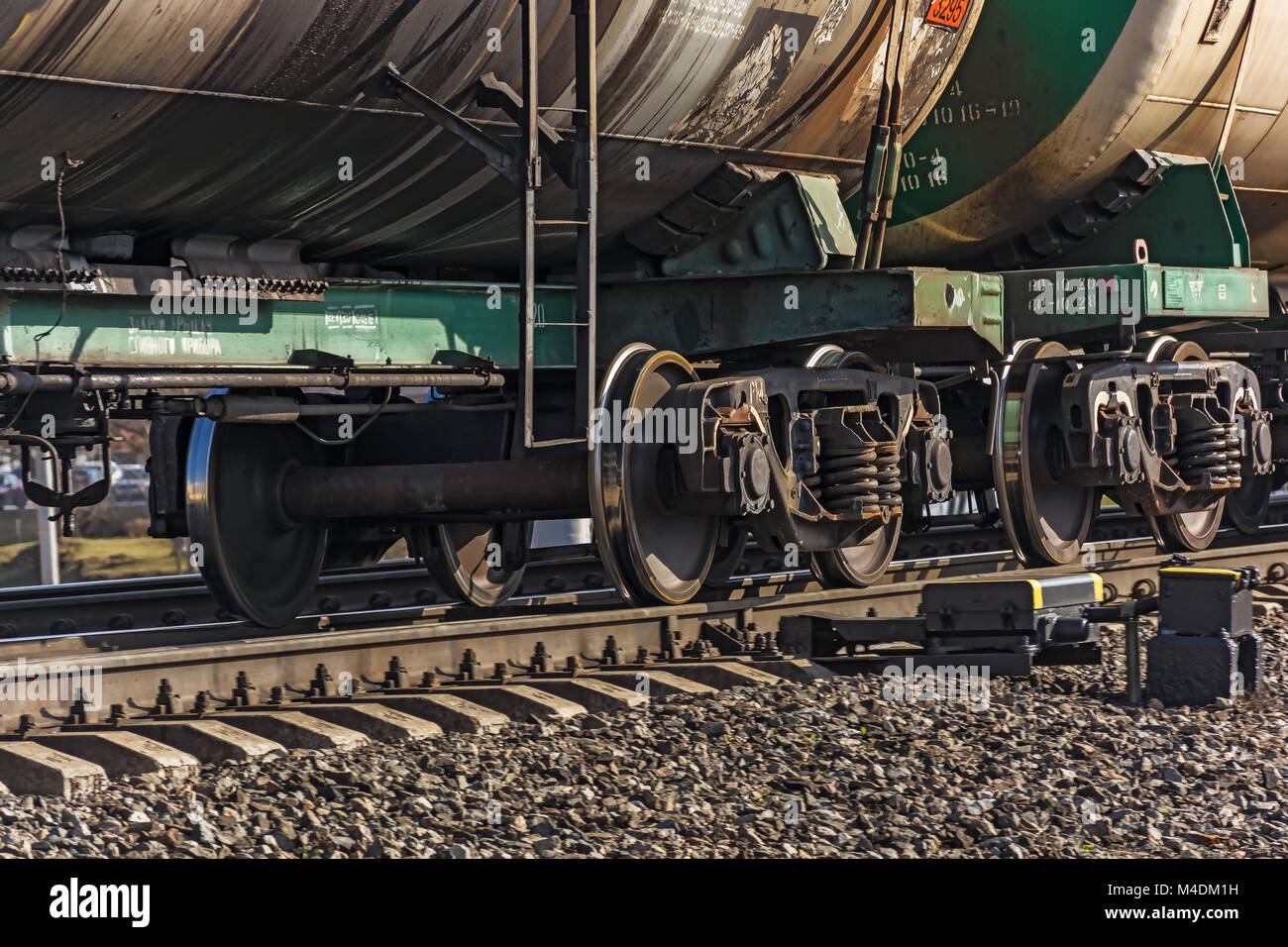 Wheeled pairs of freight wagons of train Stock Photo