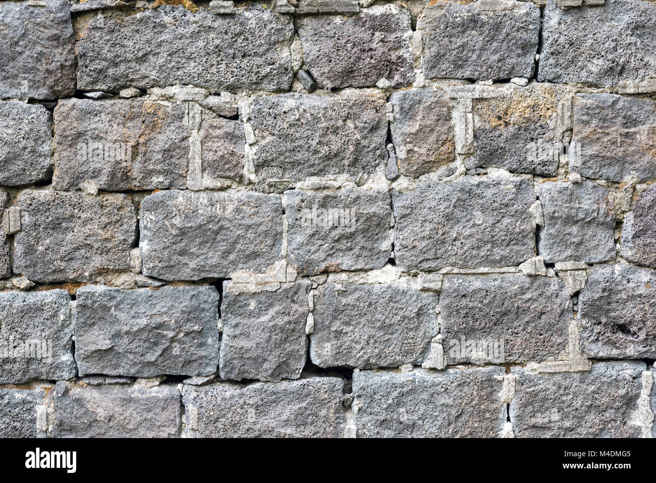 Background from an rough grey natural stone wall Stock Photo - Alamy