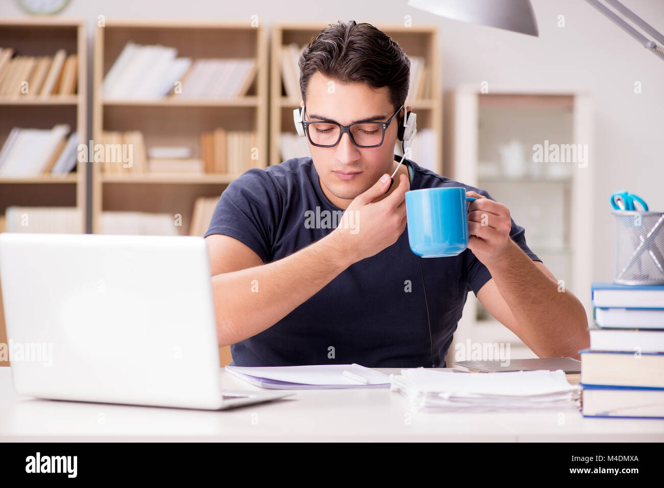 The young student drinking coffee from cup Stock Photo Alamy