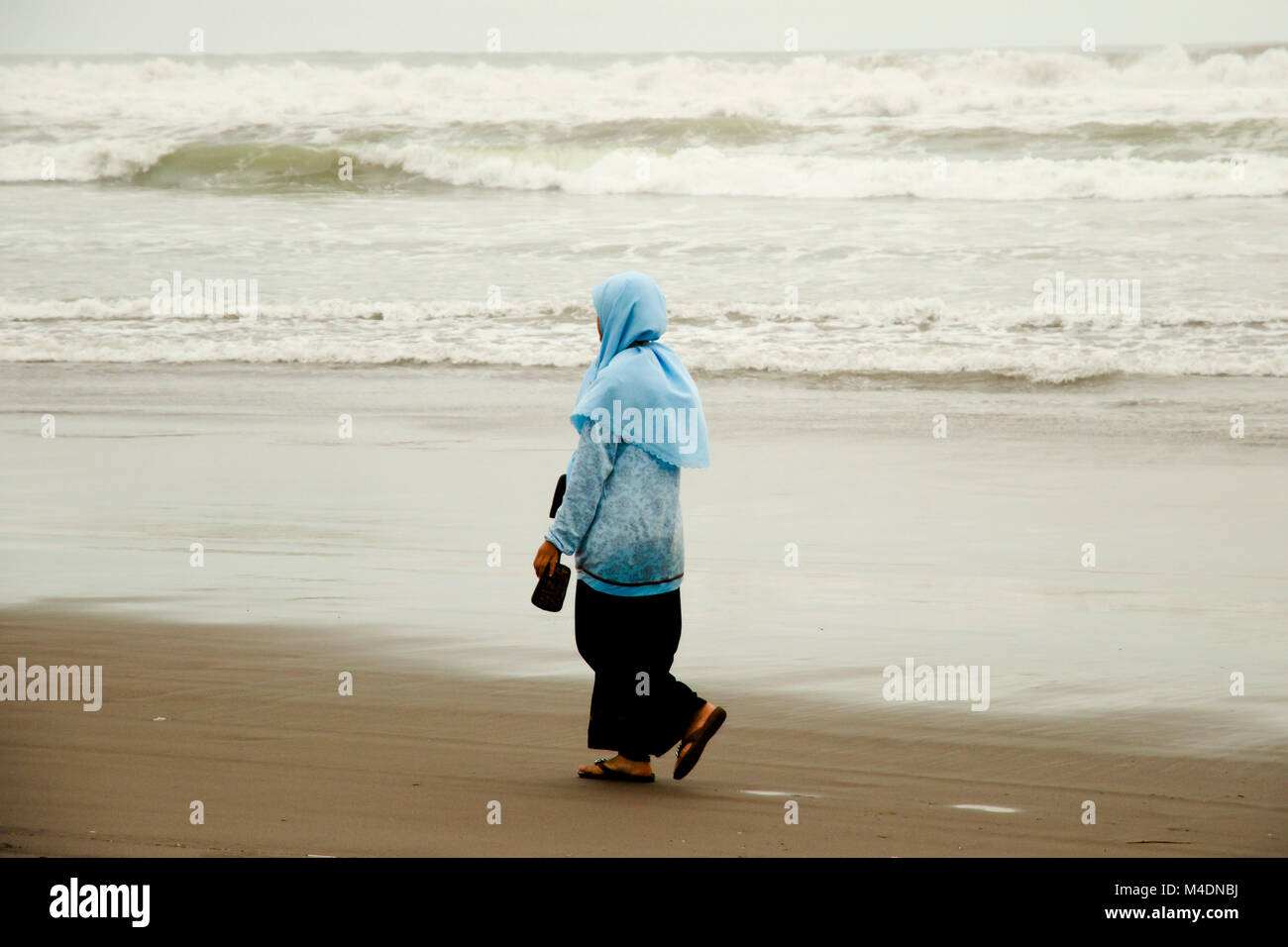 Woman on Parang Endog Beach - Jogjakarta - Indonesia Stock Photo