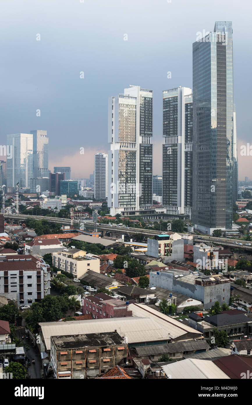 Aerial view of a residential district, mixing low rise houses and luxury condominium towers in Jakarta, Indonesia captial city. Stock Photo