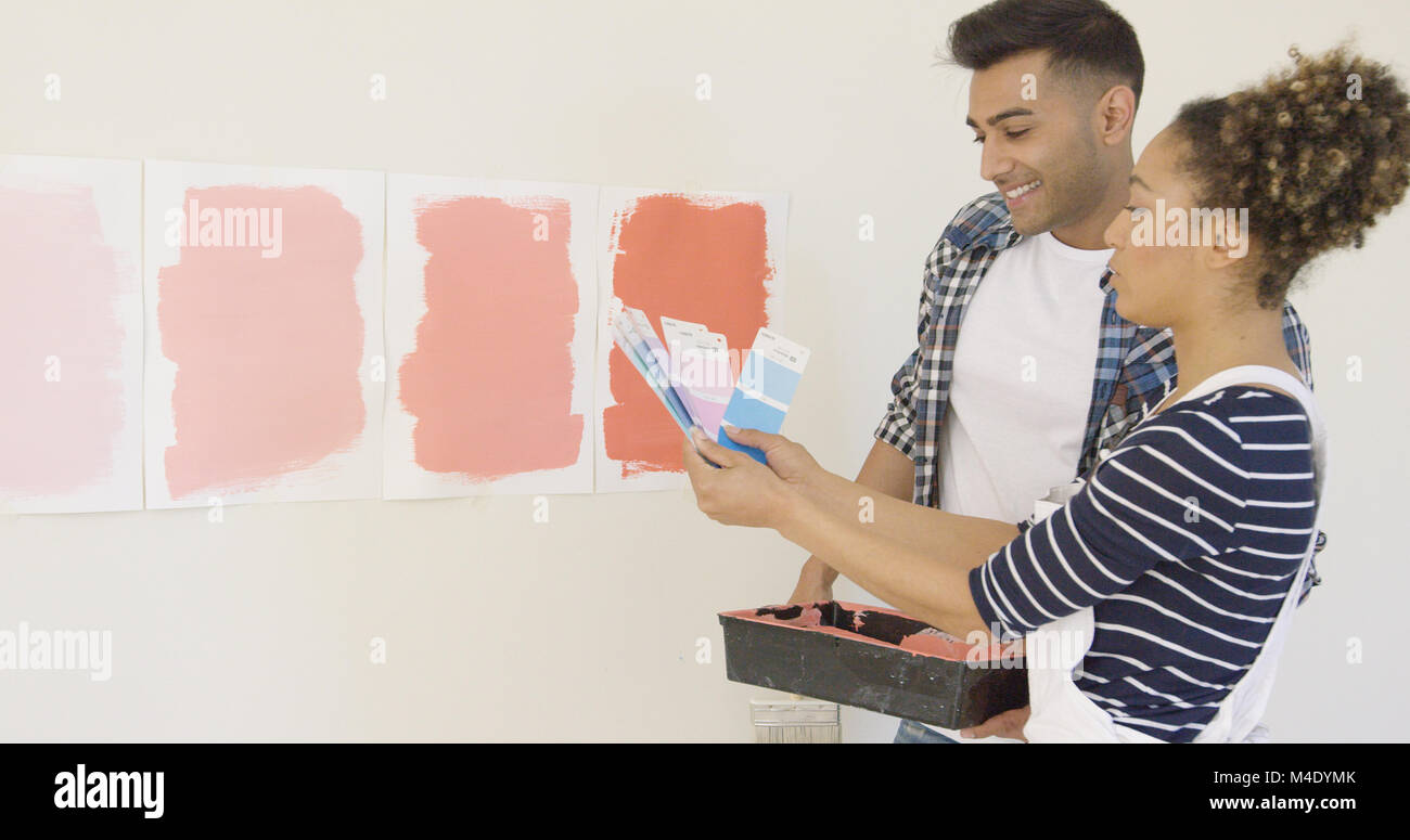 Young couple checking paint swatches Stock Photo
