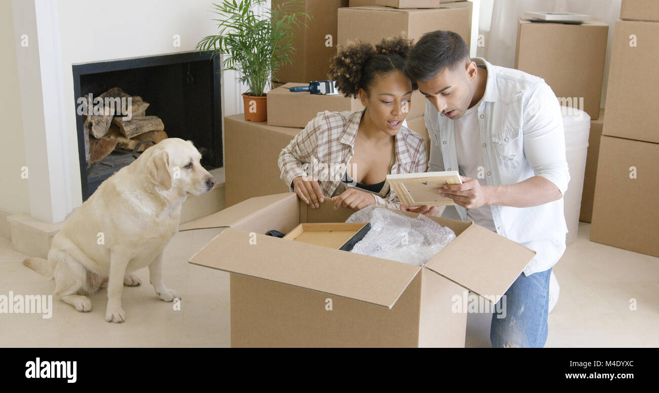 Golden retriever watching his owners pack Stock Photo
