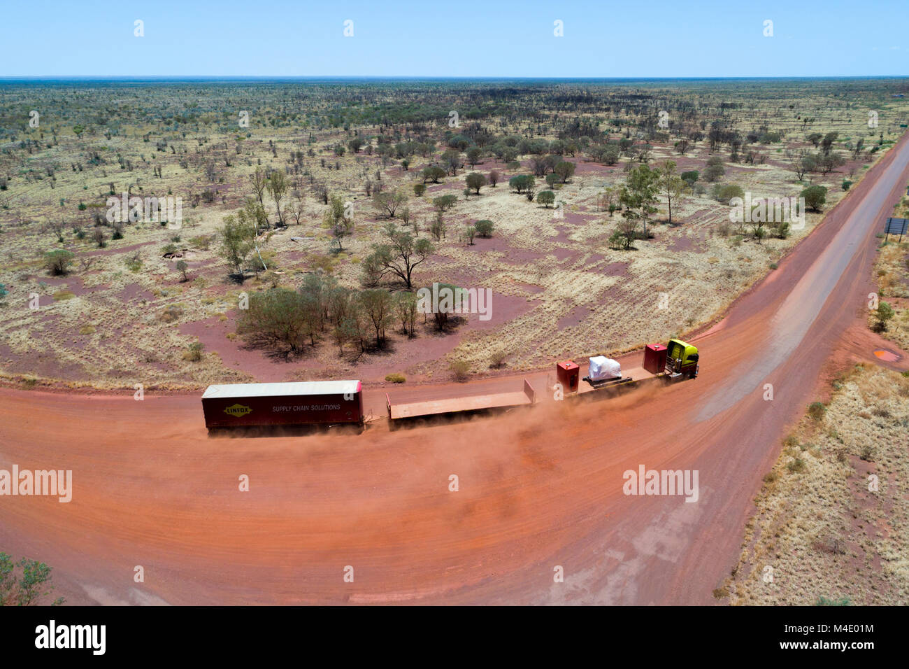 Road train on red dirt road in Australian outback, Wittenoom, Pilbara, Western Australia Stock Photo