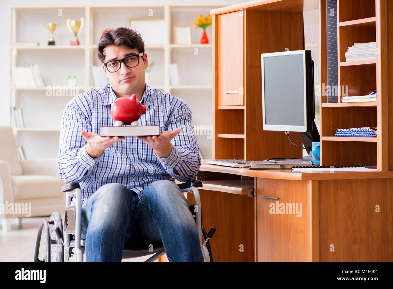 Disabled student studying at home on wheelchair Stock Photo - Alamy