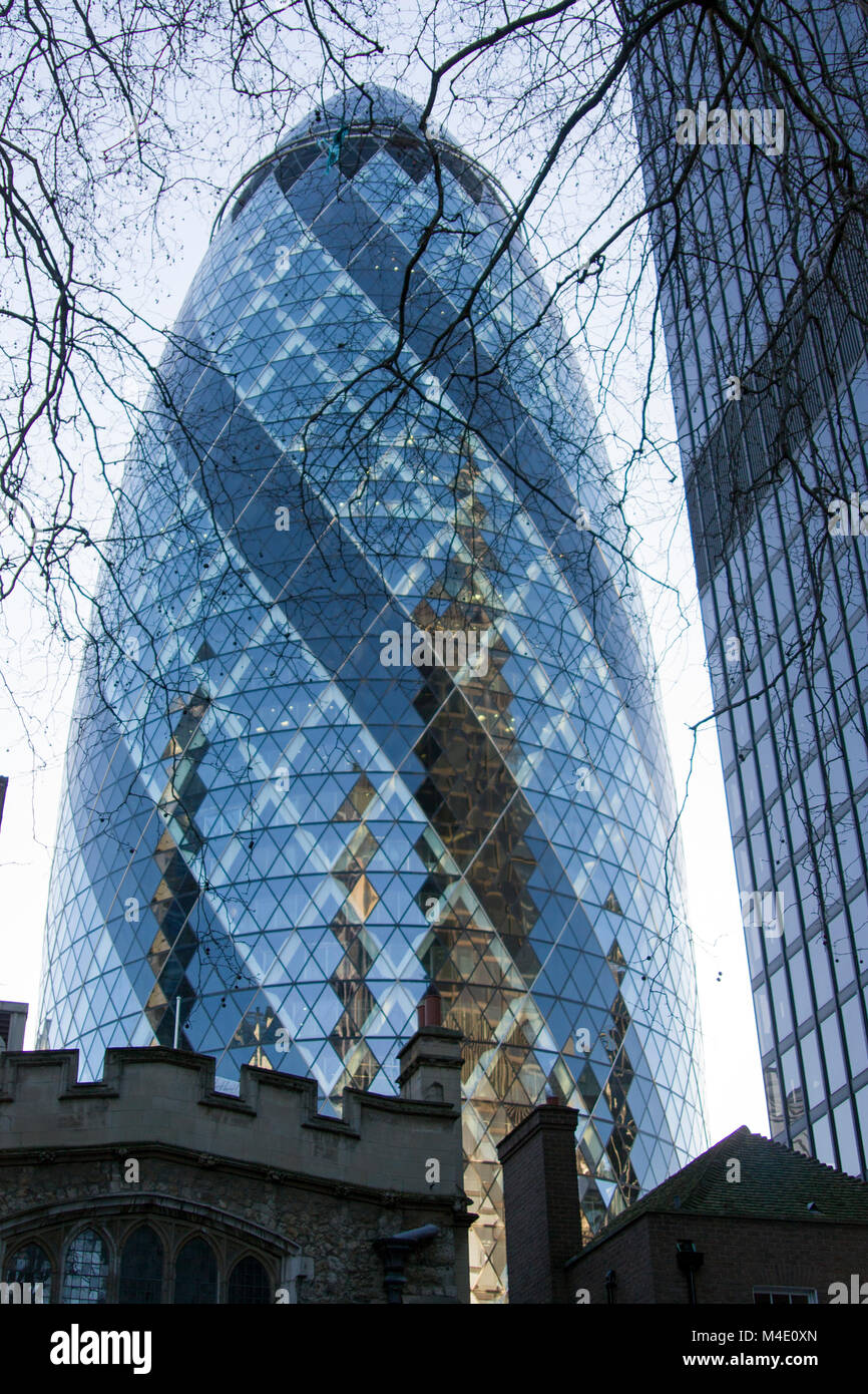 Colour Photograph of The Gherkin, 30 St Mary Axe (informally known as the Gherkin and previously as the Swiss Re Building) Skyscraper, City of London. Stock Photo