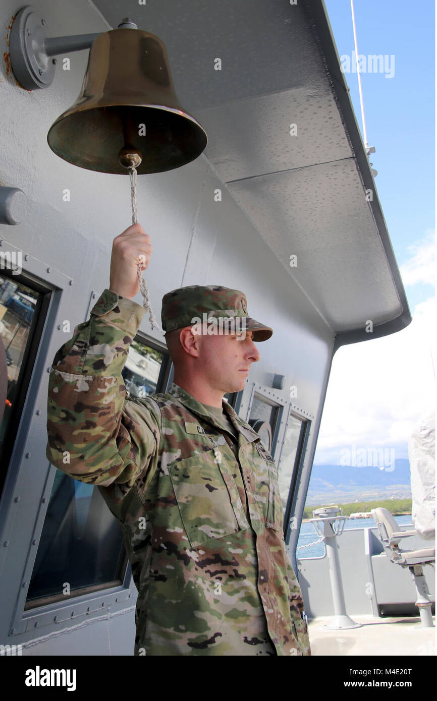 Chief Warrant Officer Two Herbert Carter rings the bell aboard the