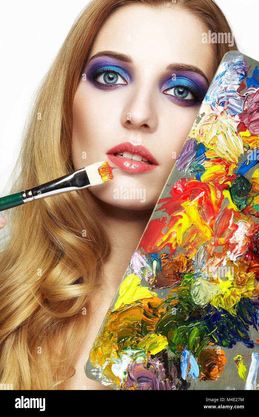 Young woman painter with color palette and paint brush Stock Photo - Alamy