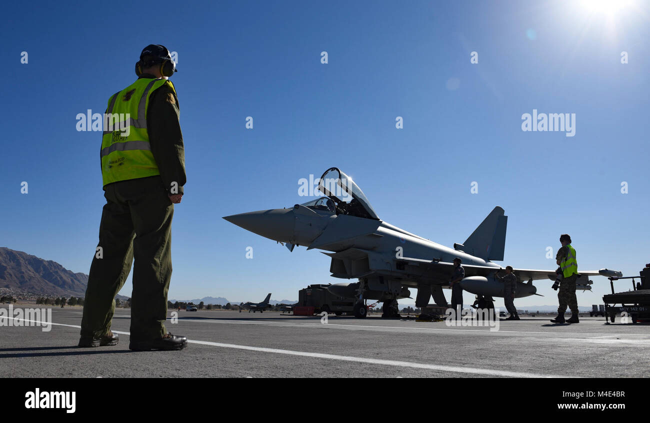 A Royal Air Force members observes pre-flight checks on a Eurofighter Typhoon assigned to No. 11 Squadron, RAF Coningsby, during Red Flag 18-1 at Nellis Air Force Base, Nevada, Feb. 5, 2018. No. 11 Squadron is one of the oldest flying squadrons in the RAF. (U.S. Air Force Stock Photo