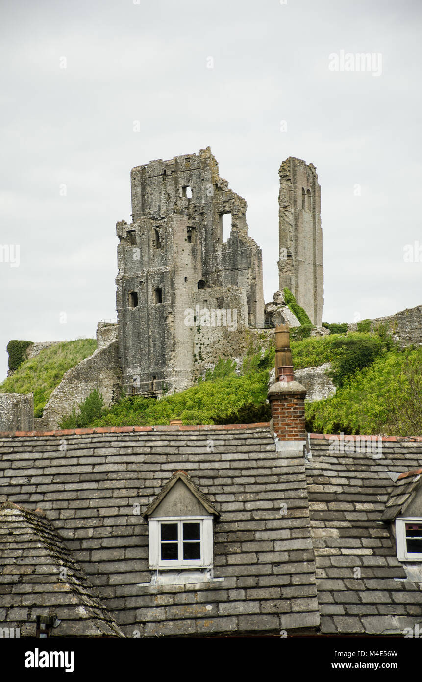 Corfe Castle with village roofs Stock Photo