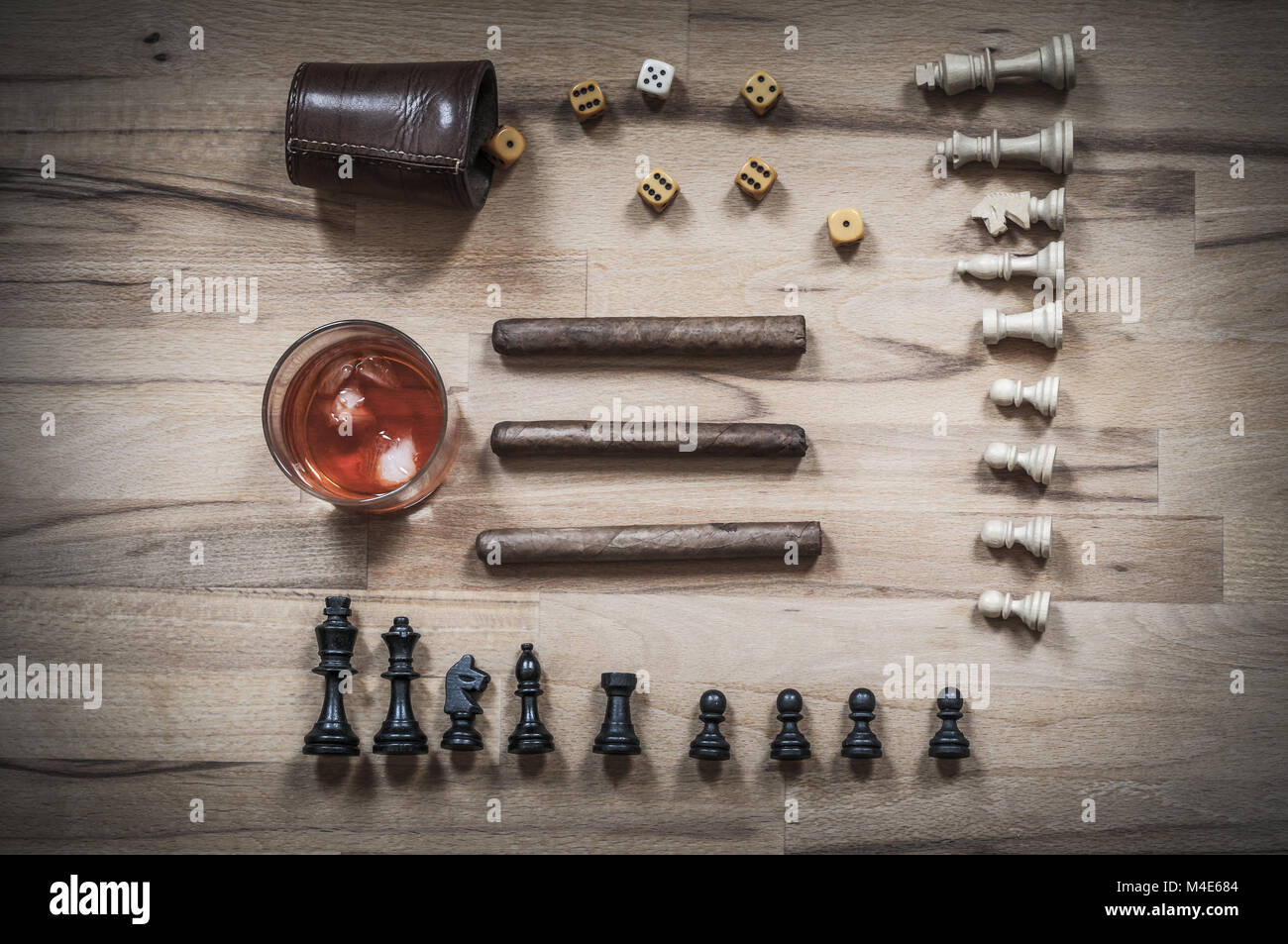 Dice game, chess piece, cigars and alcoholic beverages Stock Photo