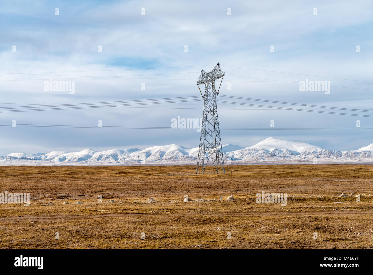 power transmission towers on plateau Stock Photo
