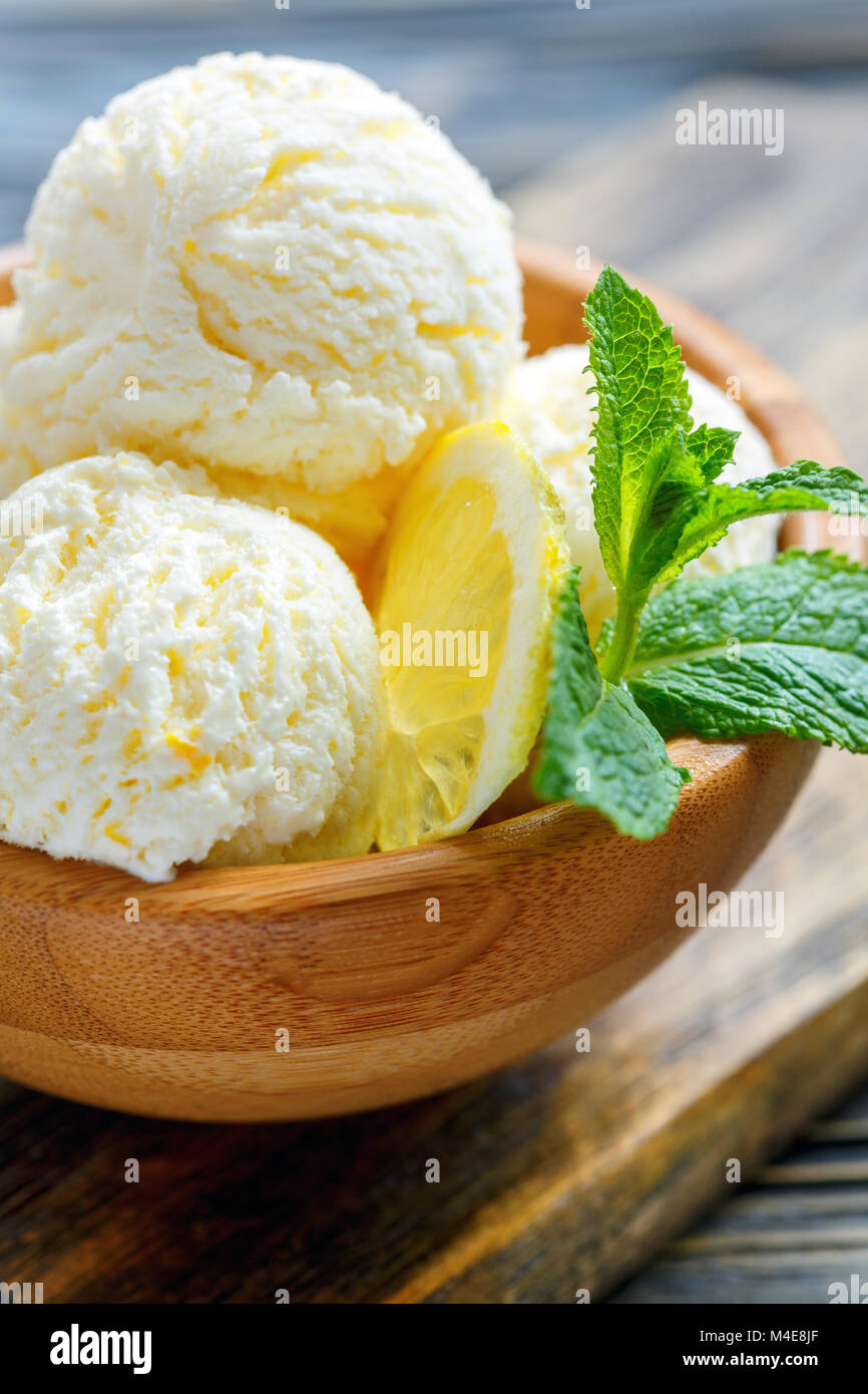 Bowl of lemon ice cream and mint close up. Stock Photo