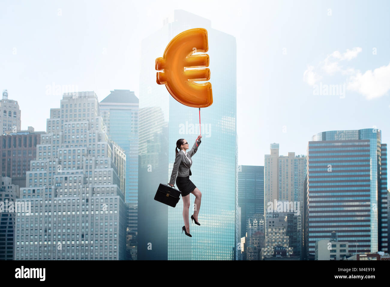 Businesswoman flying on euro sign inflatable balloon Stock Photo - Alamy