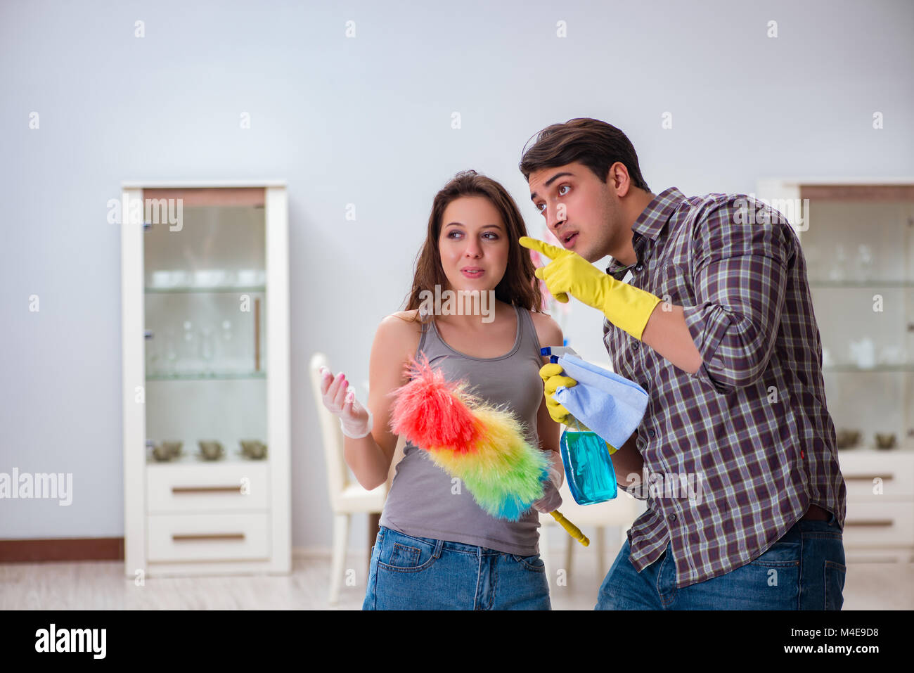 Wife and husband doing cleaning at home Stock Photo - Alamy