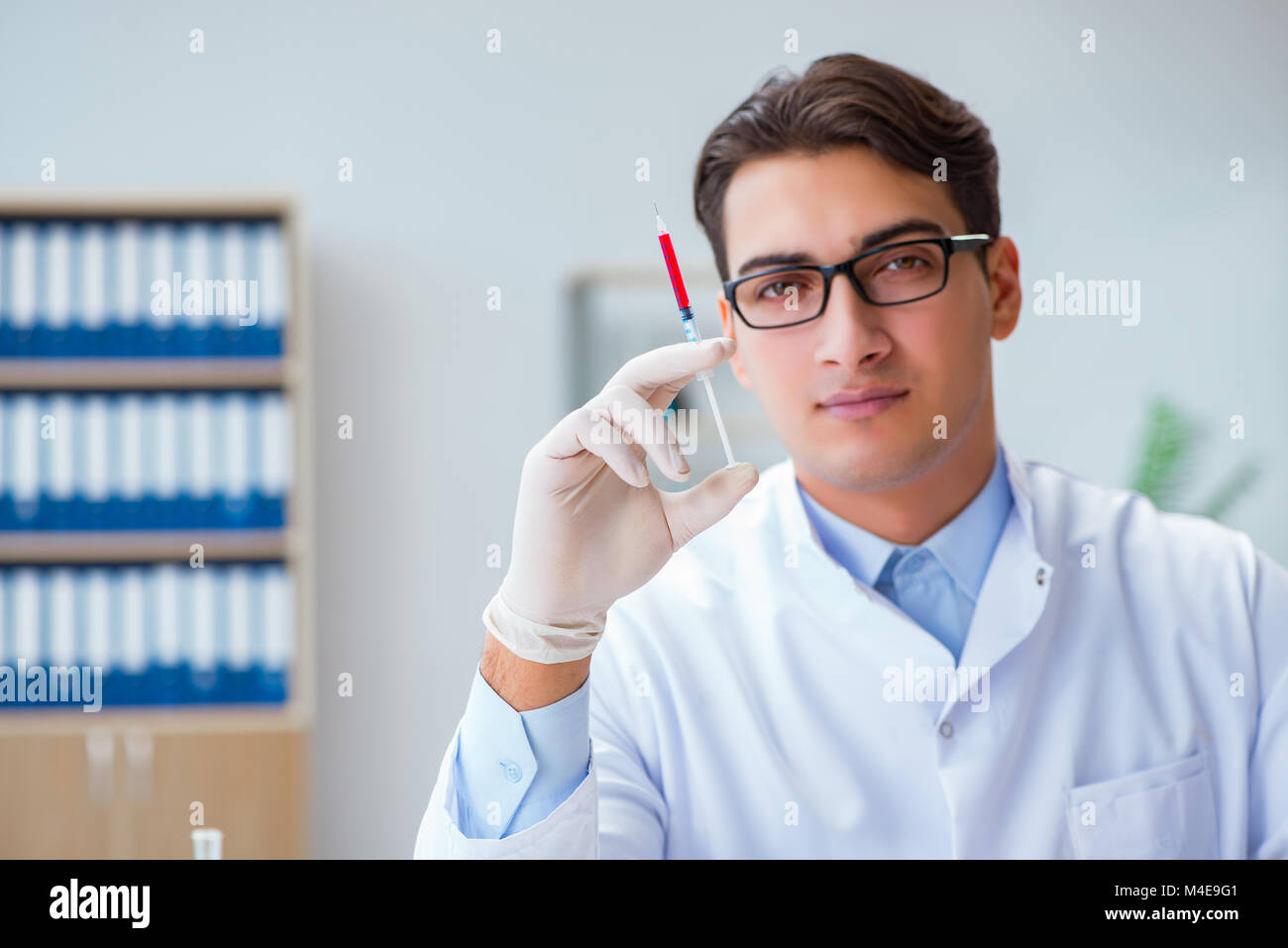 Doctor working with blood samples Stock Photo Alamy