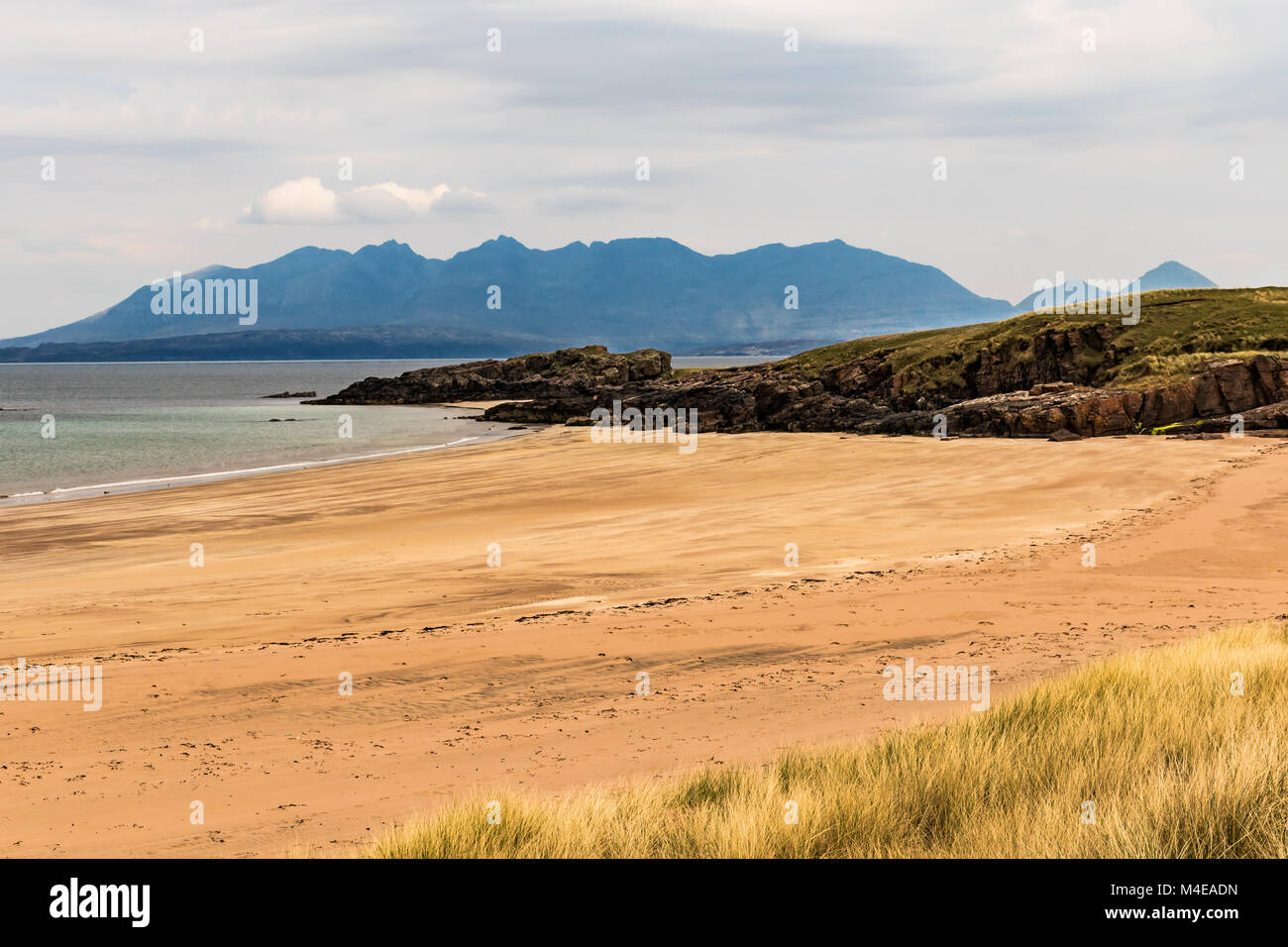 Isle of Skye as seen from a beach on Isle of Rum Stock Photo