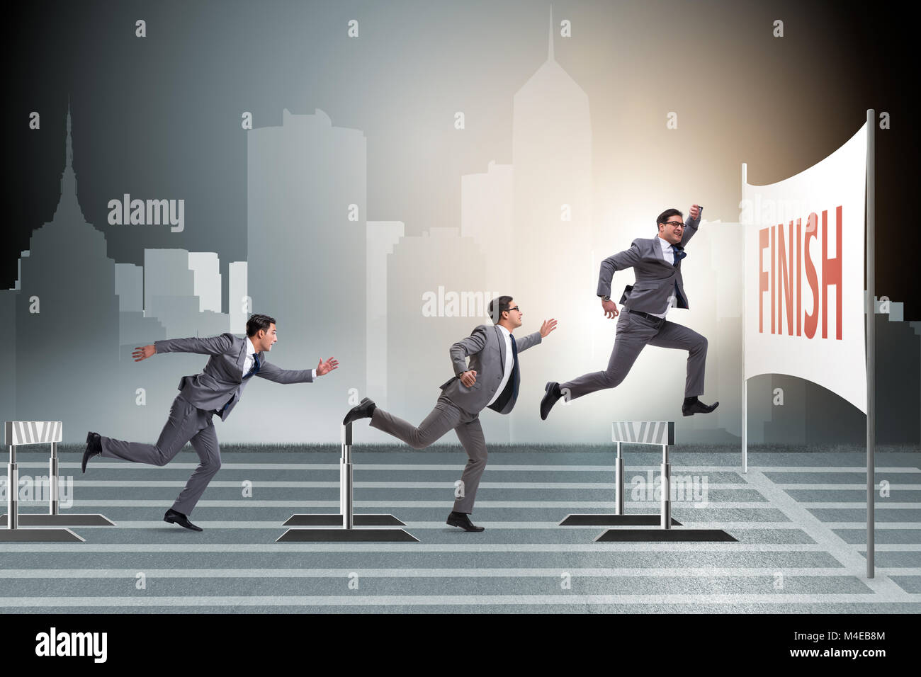 Businessman jumping over barriers in business concept Stock Photo Alamy