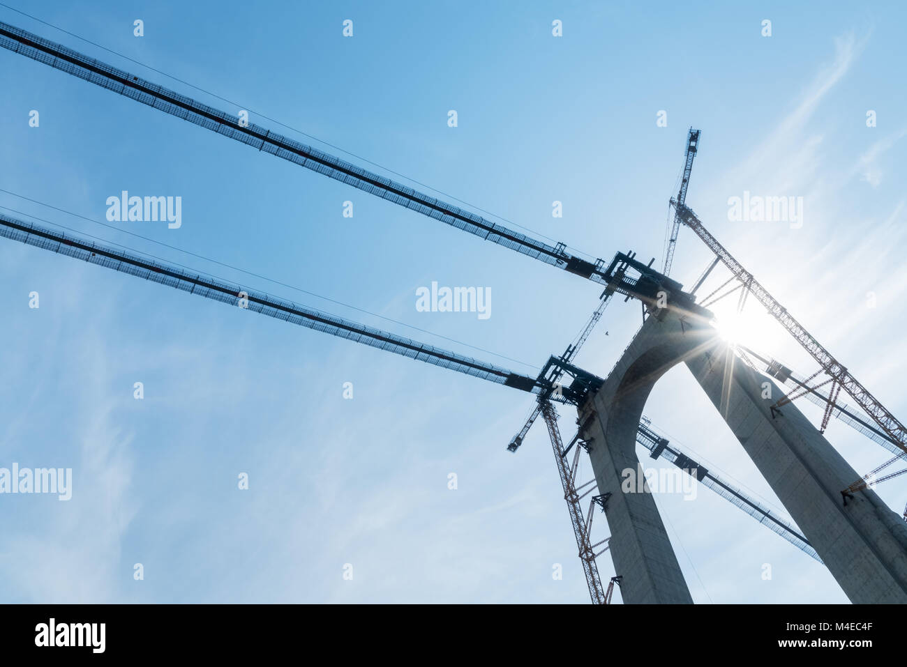 bridge tower with crane closeup Stock Photo