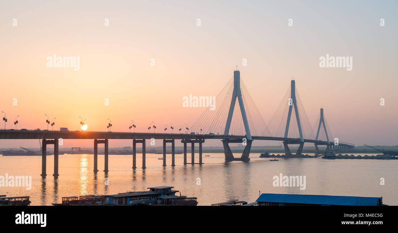 dongting lake bridge with setting sun Stock Photo