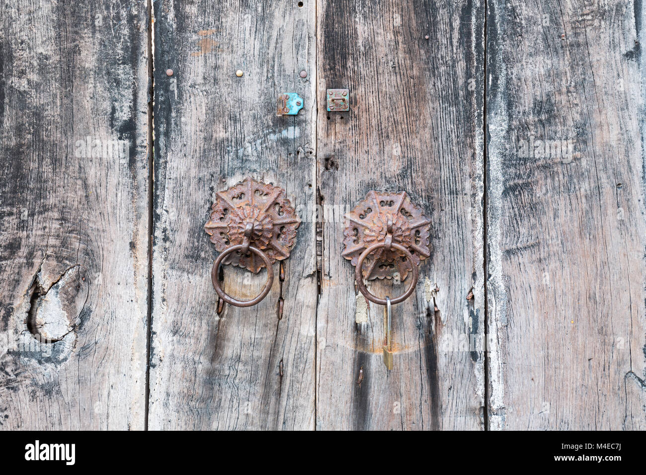 aged wooden door knocker Stock Photo