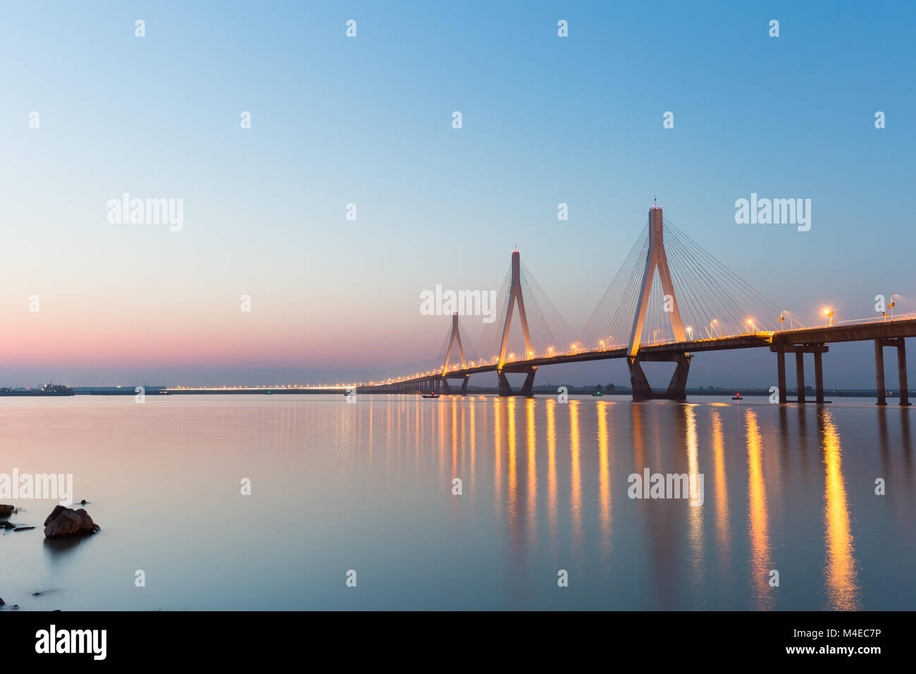 cable-stayed bridge in nightfall Stock Photo