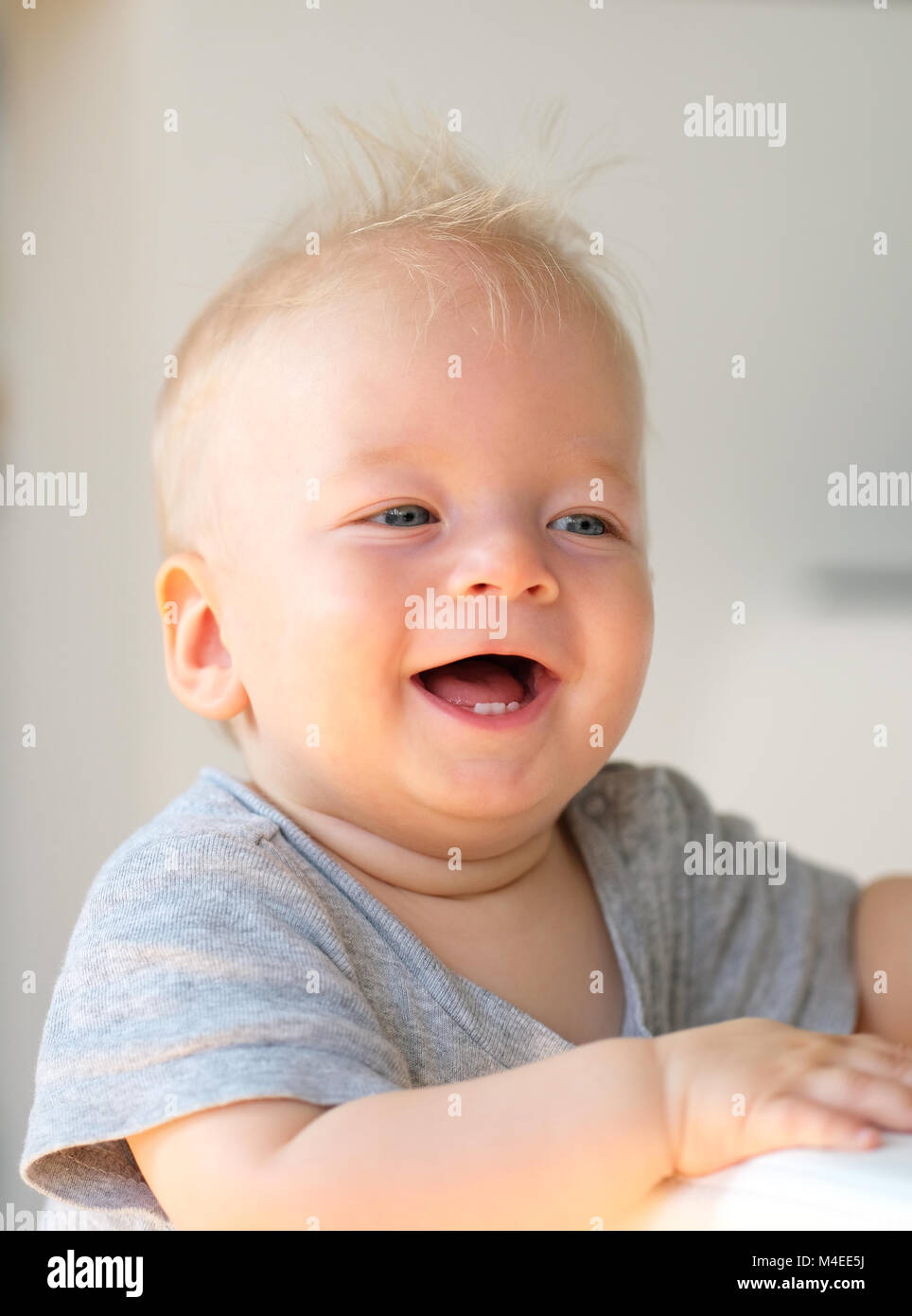 Baby boy with blue eyes Stock Photo Alamy