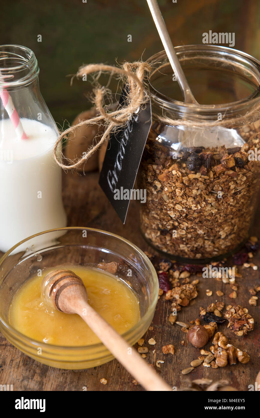 Granola with honey and milk Stock Photo Alamy